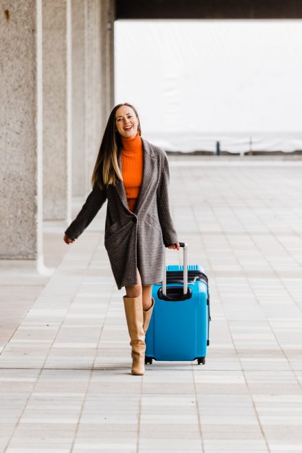 Woman walking down with her luggage
